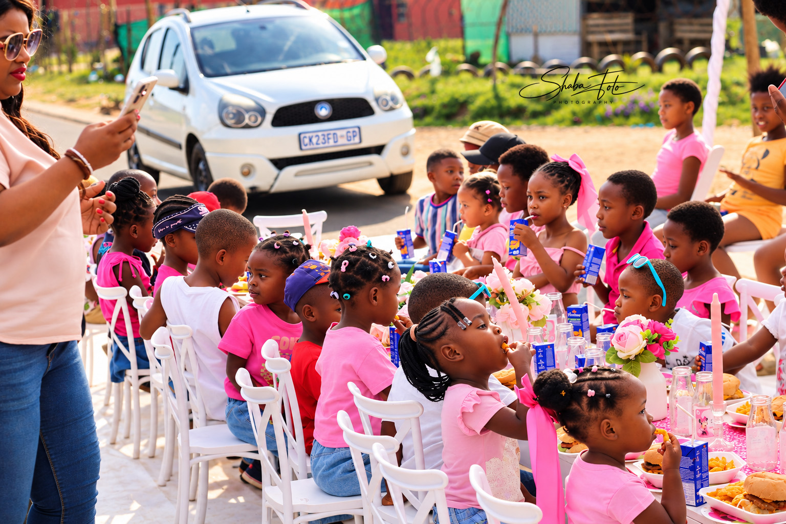 Guests gathered around decorated tables at an outdoor celebration